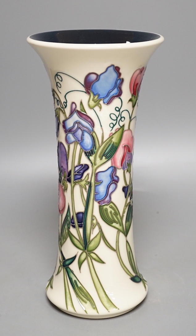 A Moorcroft 'sweetness' vase, boxed, 25 cms high.